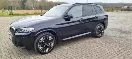 BMW iX3 M Carbonschwarz Impressive of Squall