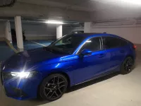 Honda Civic Bleu Cristallin Premium Advance de pierre